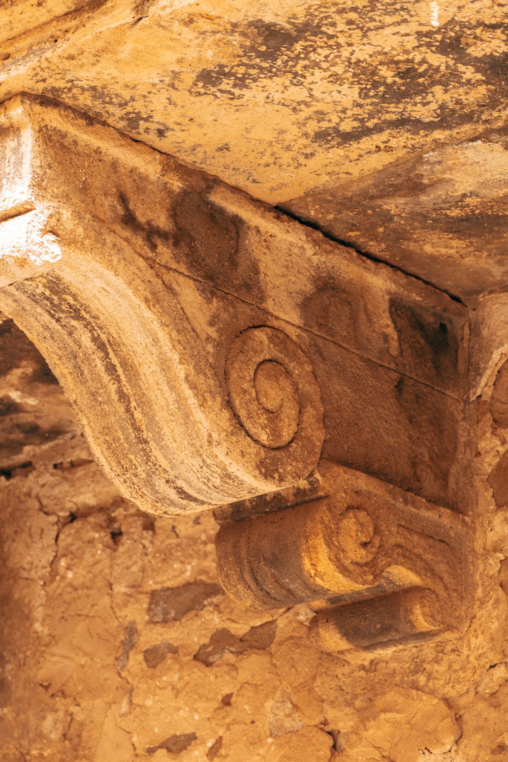 a close up of a stone structure with carvings on it
