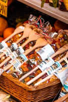 A basket filled with golden dried pasta varieties, highlighting texture and color.