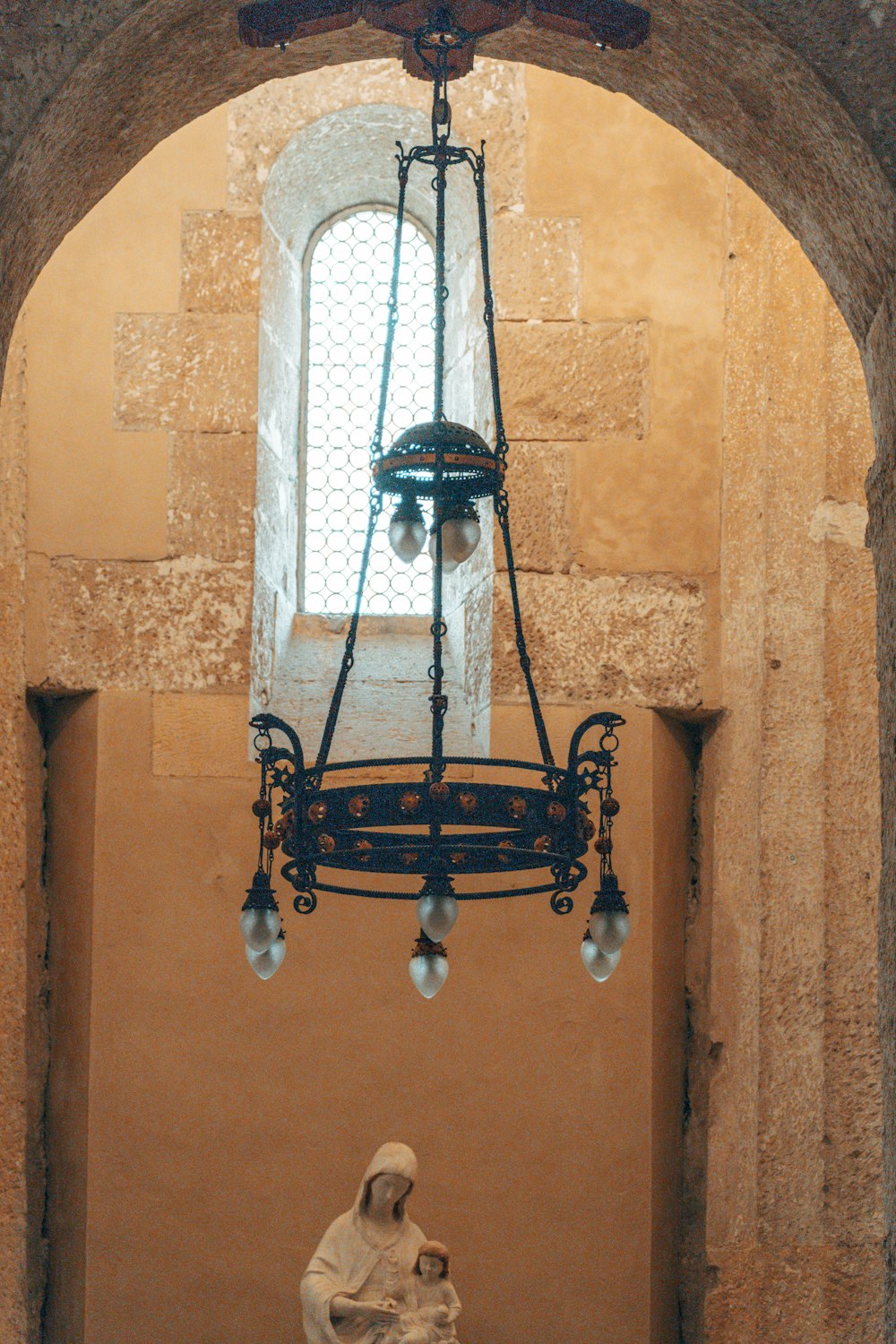 a chandelier hanging from the ceiling of a building