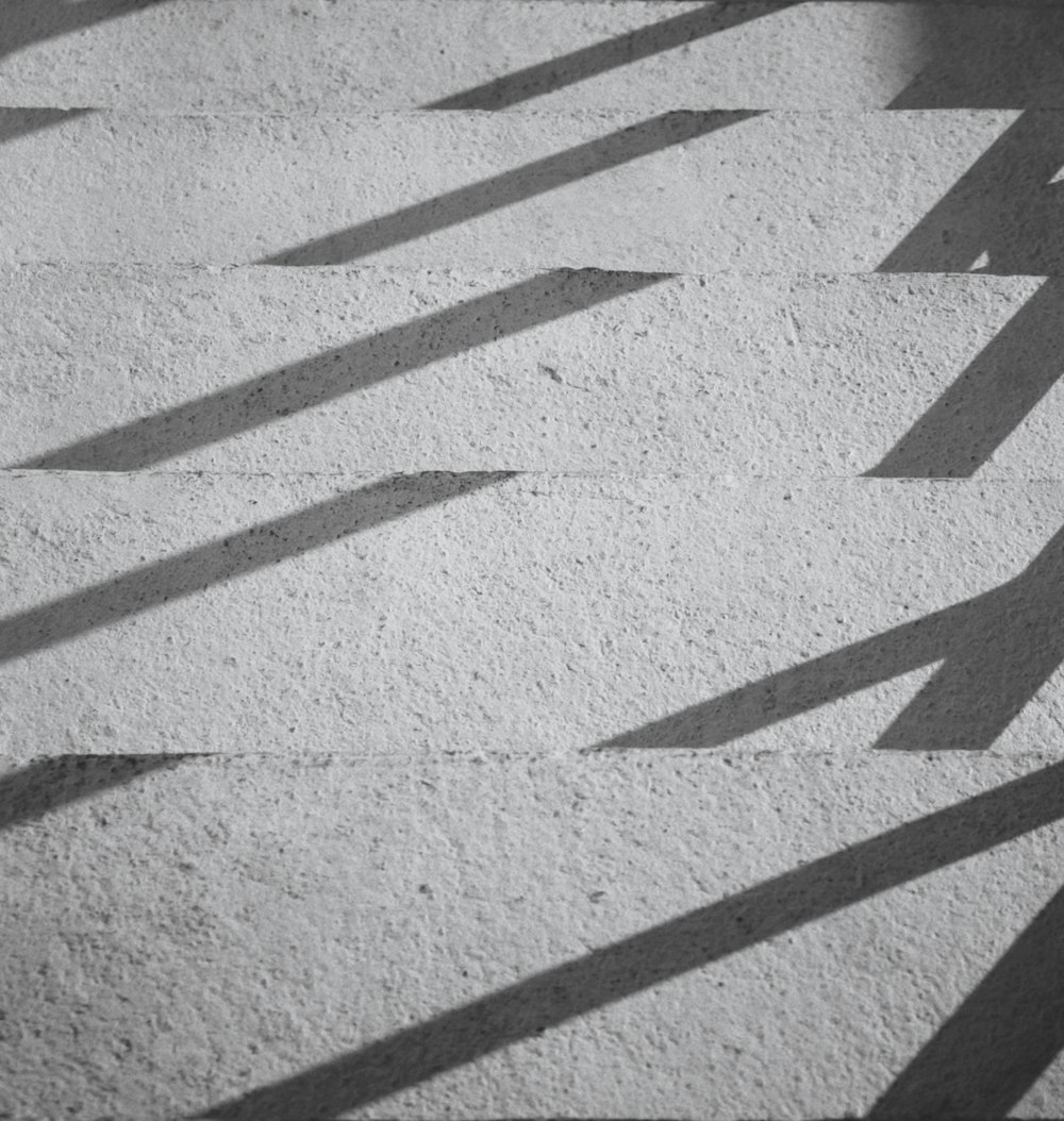 a black and white photo of a concrete floor