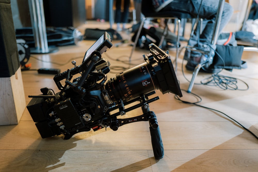 a camera sitting on top of a wooden floor