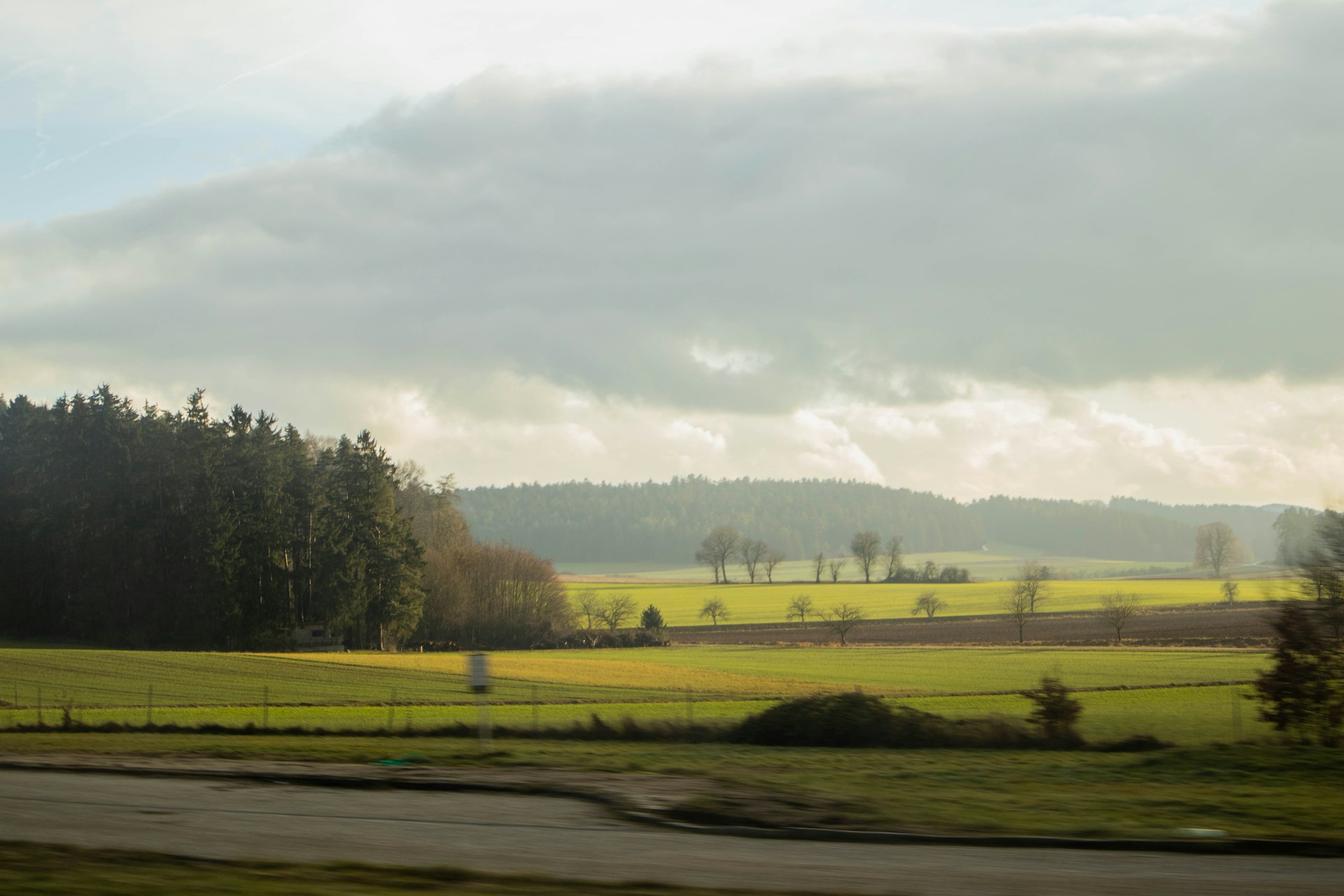 woman wearing yellow long-sleeved dress under white clouds and blue sky during daytime