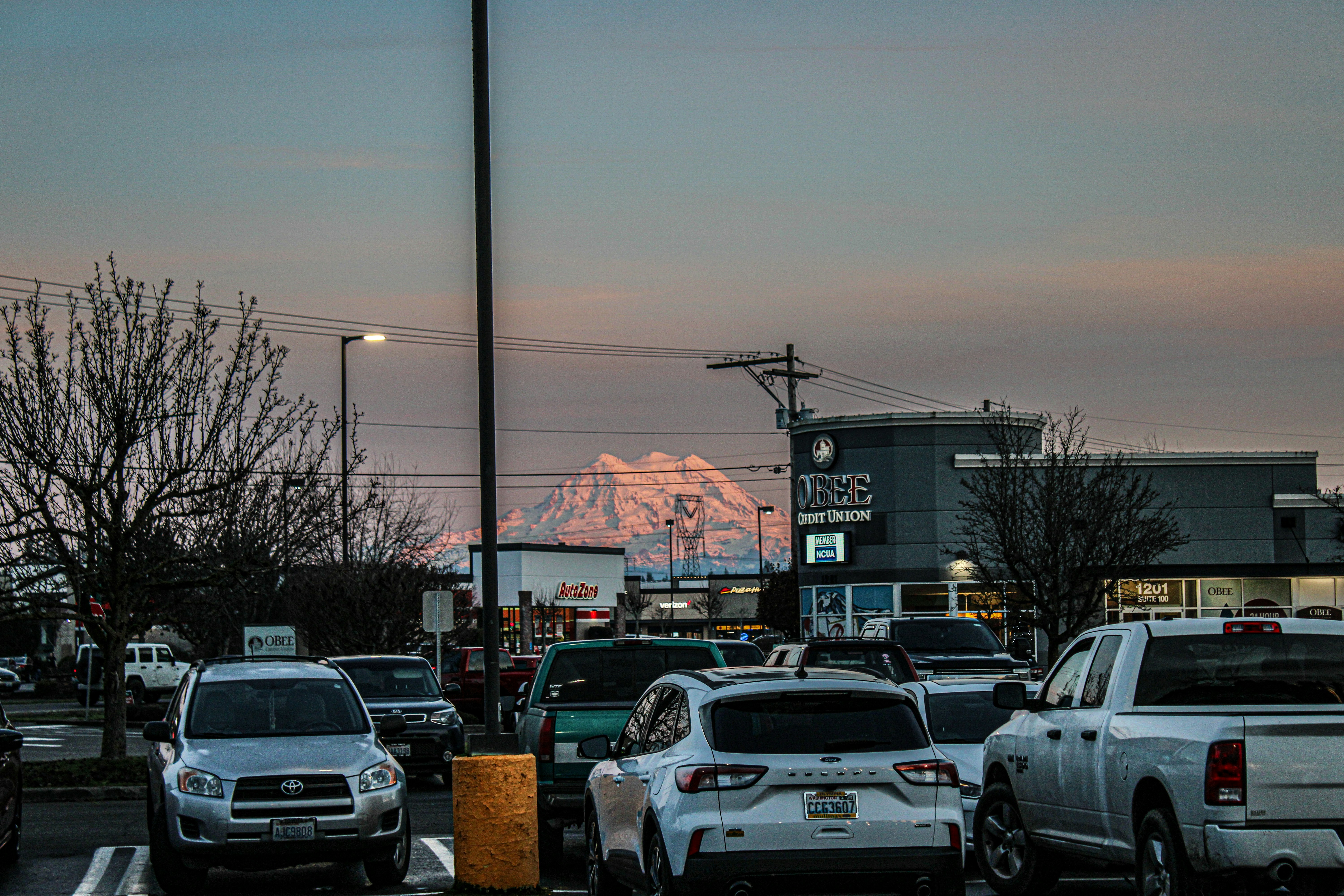 A parking lot filled with lots of parked cars photo Free Yelm Image
