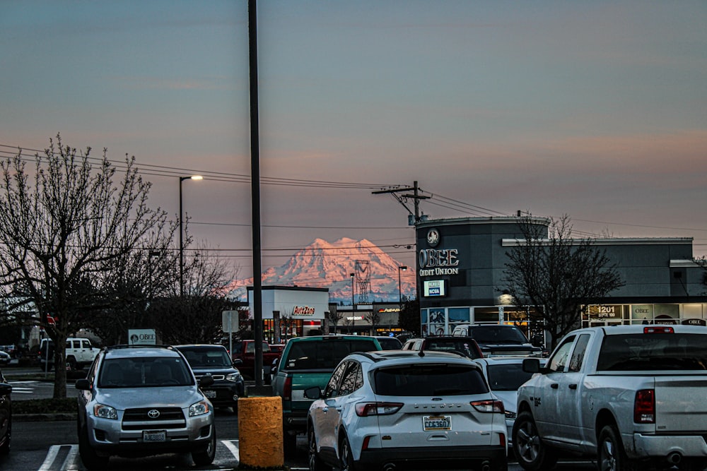 a parking lot filled with lots of parked cars