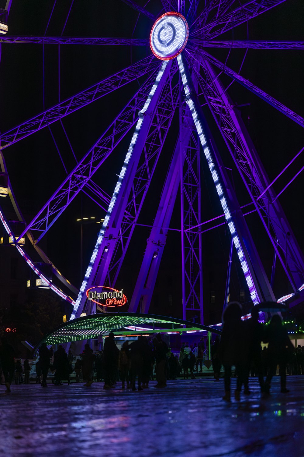 a large ferris wheel lit up at night