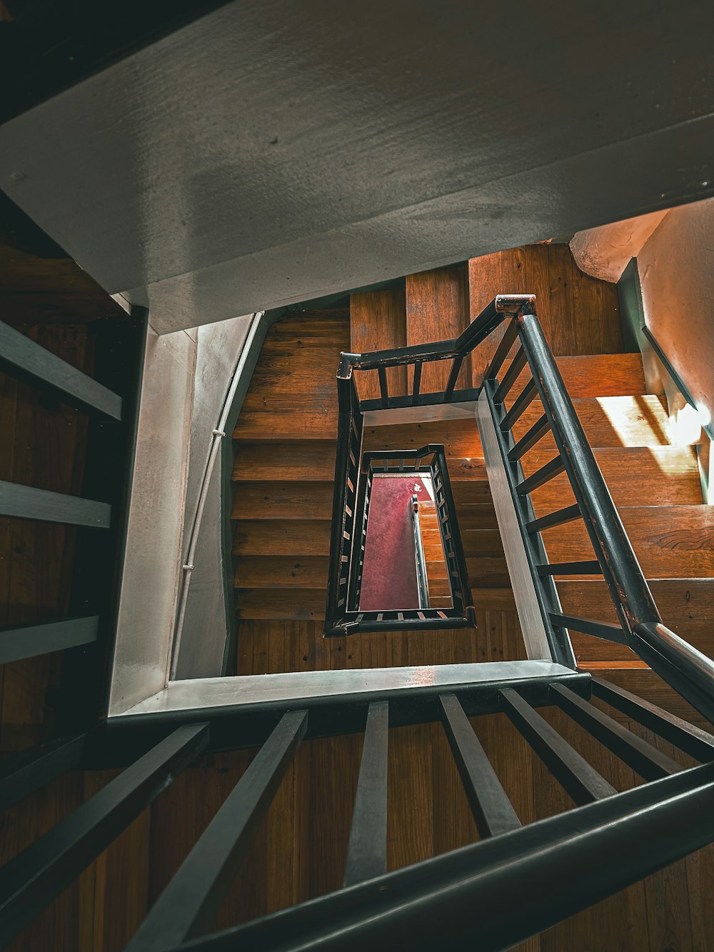 a view of a staircase from the top of it