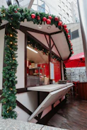A festive market stall with bright signs announcing special offers