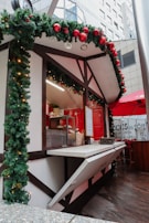 A festive market stall decorated with banners announcing special discounts.