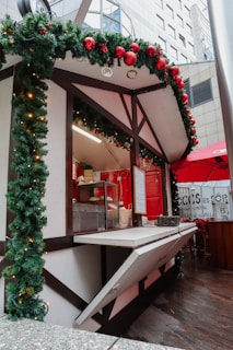 A festive market stall decorated with banners announcing special discounts.