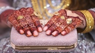 A close-up shot of elegant bridal clutch frames with intricate designs.