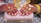 Close-up of a hand holding a beautifully detailed hand-printed clutch with bold patterns