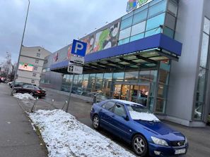 Commercial property façade with clear signage and parking.