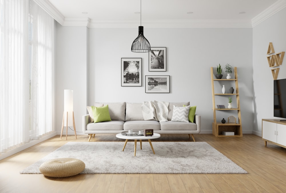 a living room with a white couch and a white rug