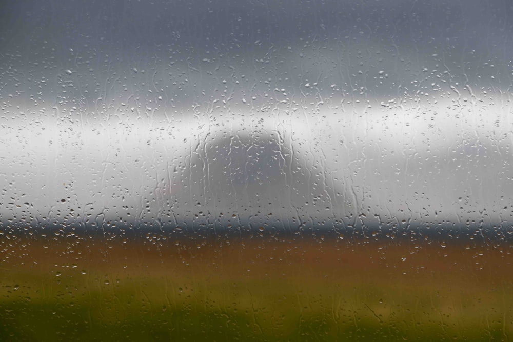 rain drops on a window with a blurry background