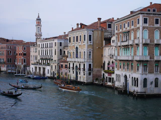 A charming canal view in Venice with gondolas and colorful buildings.