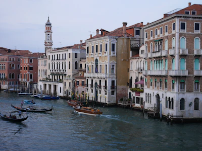 A charming canal view in Venice with gondolas and colorful buildings.