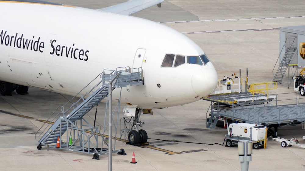 a large jetliner sitting on top of an airport tarmac