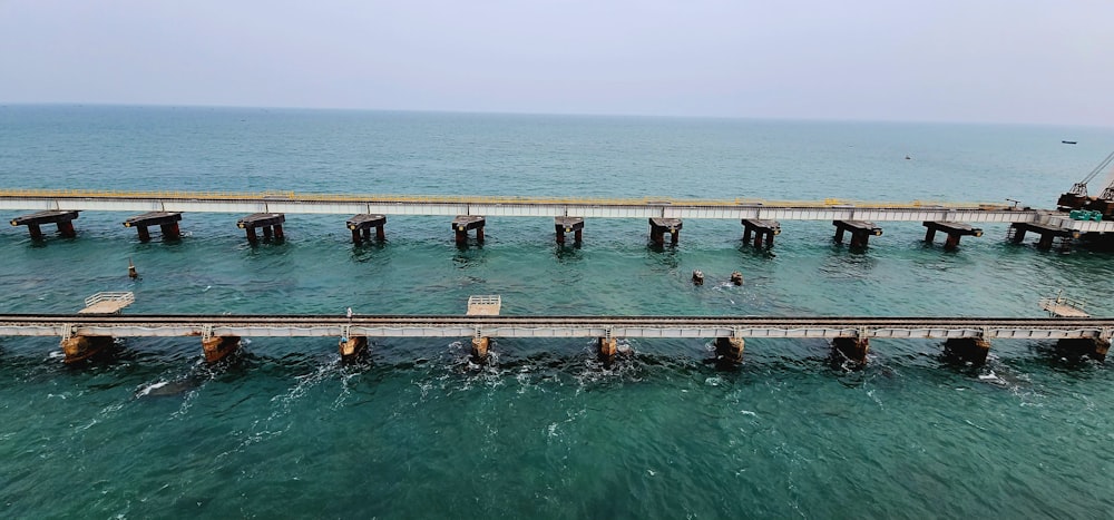 a pier in the middle of a body of water