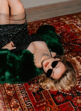 A stylish Russian model relaxing in a modern apartment setting.