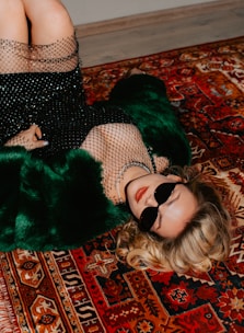 A stylish Russian model relaxing in a modern apartment setting.