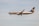 A commercial airplane flies through a clear sky. The aircraft is painted in Ryanair's blue and white livery, with the company's logo prominently visible on the tail.