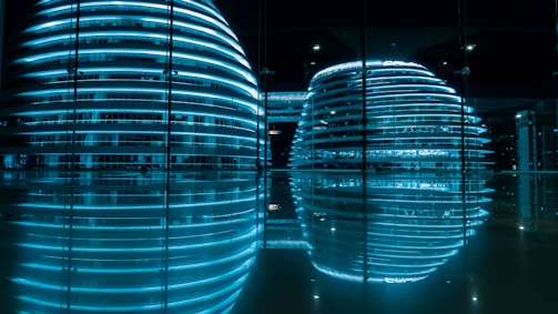 Futuristic hospital building glowing softly at dusk with digital interface overlays.