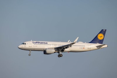 a lufthansa airplane flying in the sky