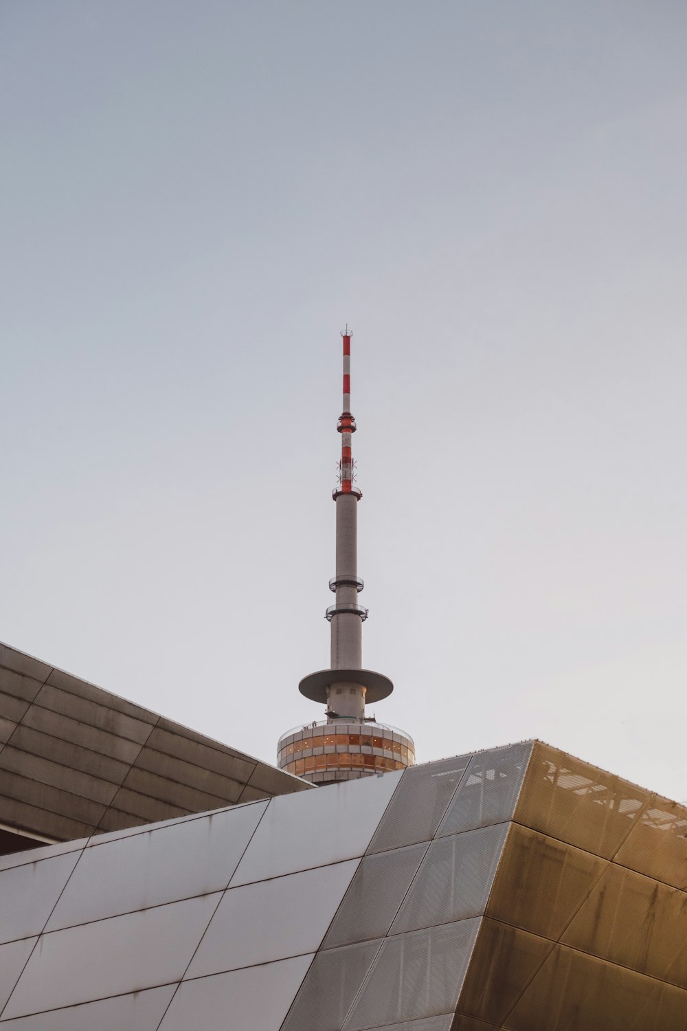 a very tall building with a very tall tower in the background