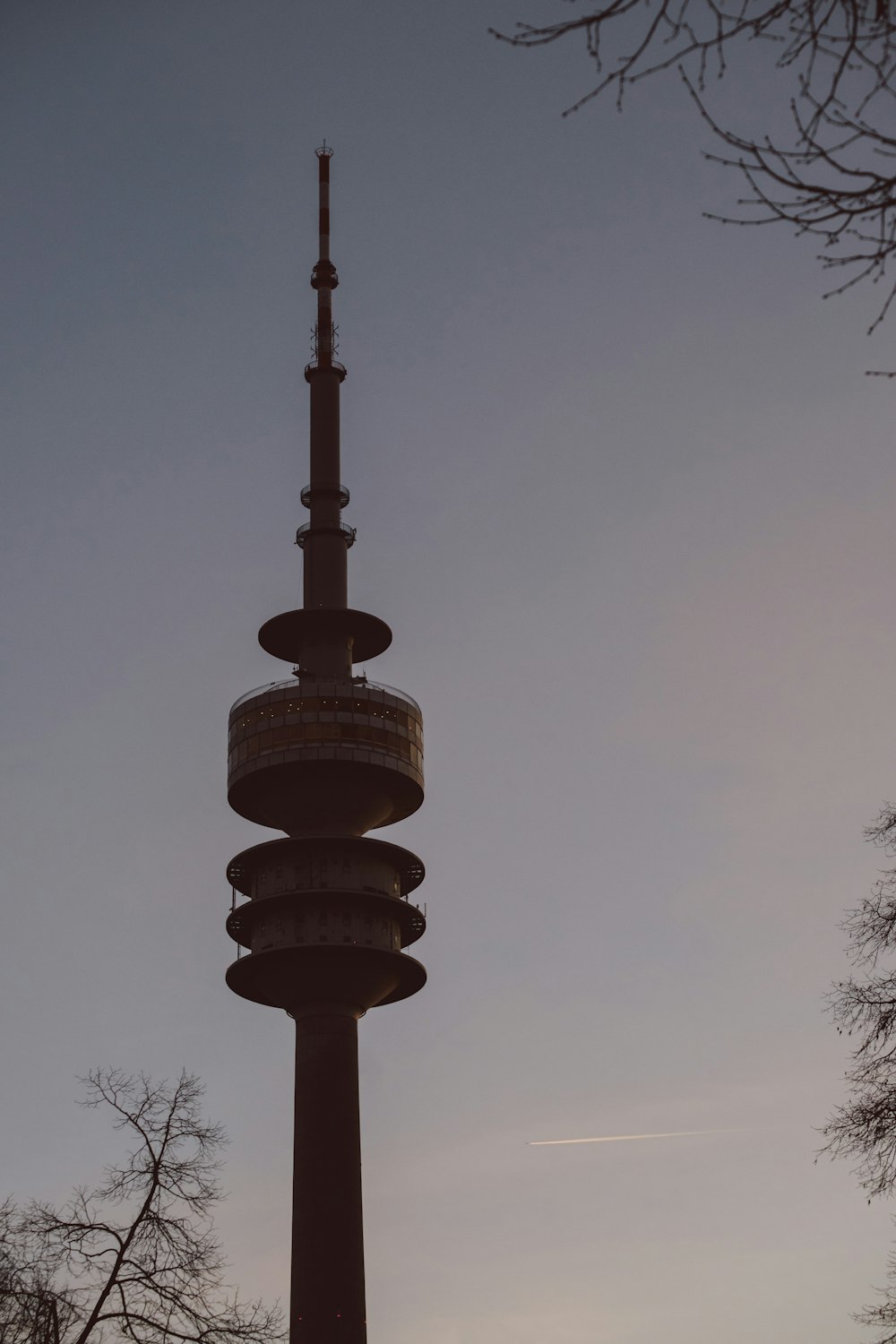 a tall tower with a clock on the top of it