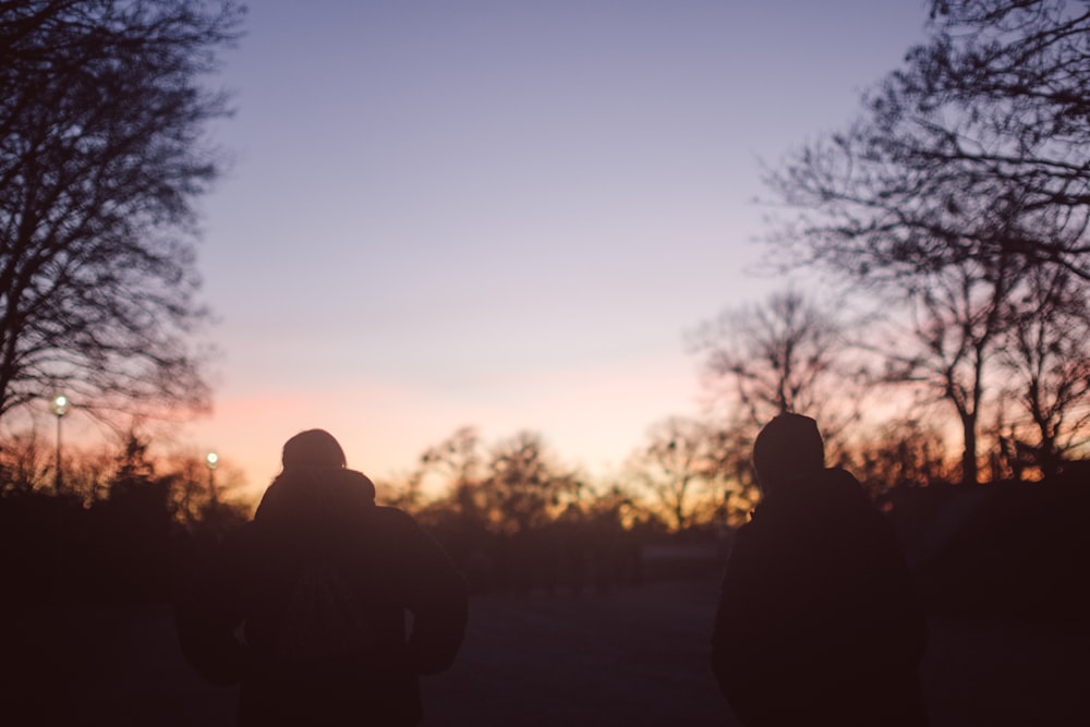 a couple of people standing next to each other