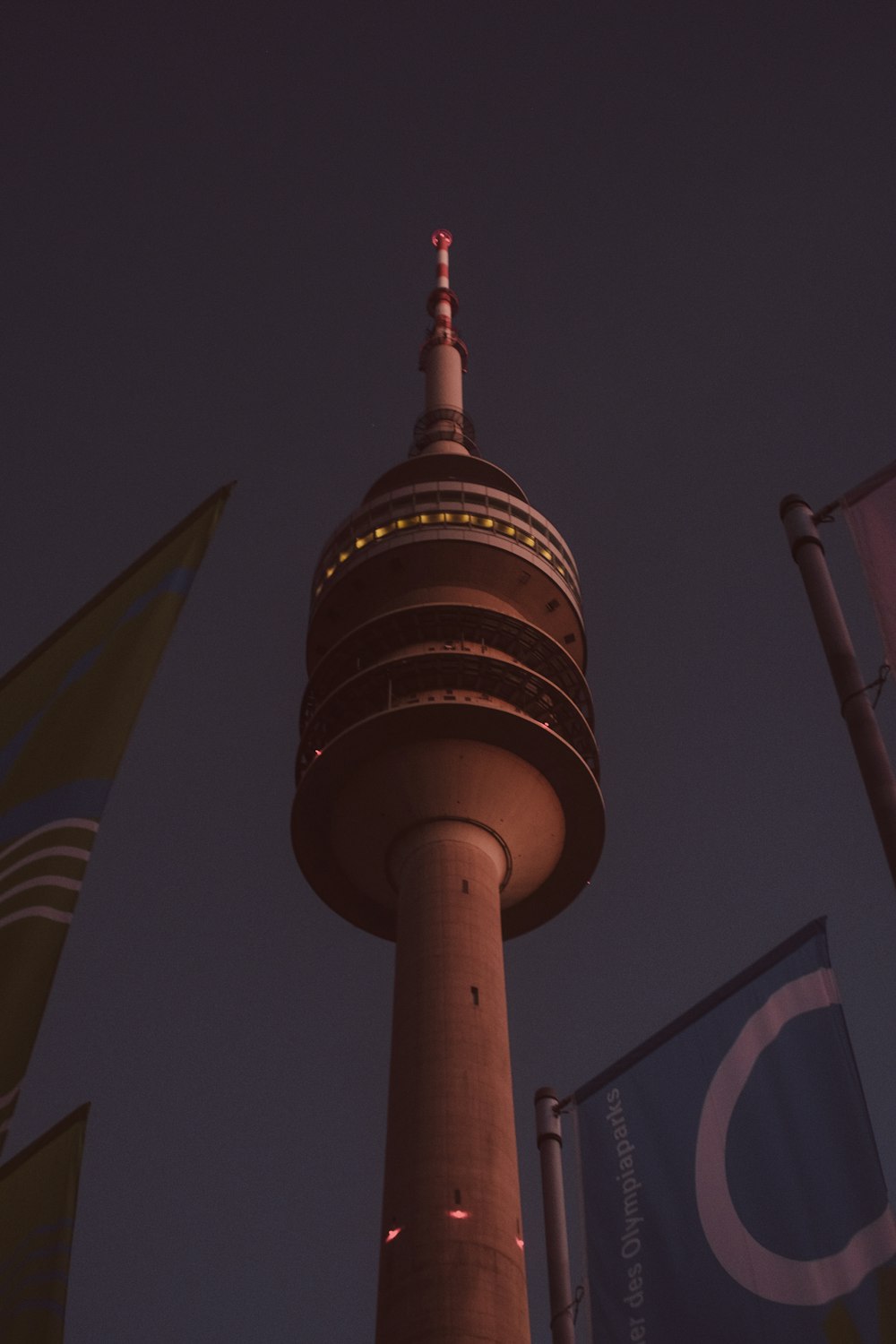 a very tall tower with a clock on it's side