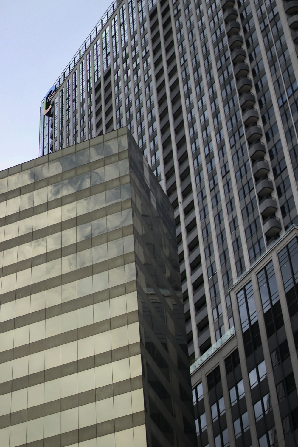 a tall building with a man on top of it