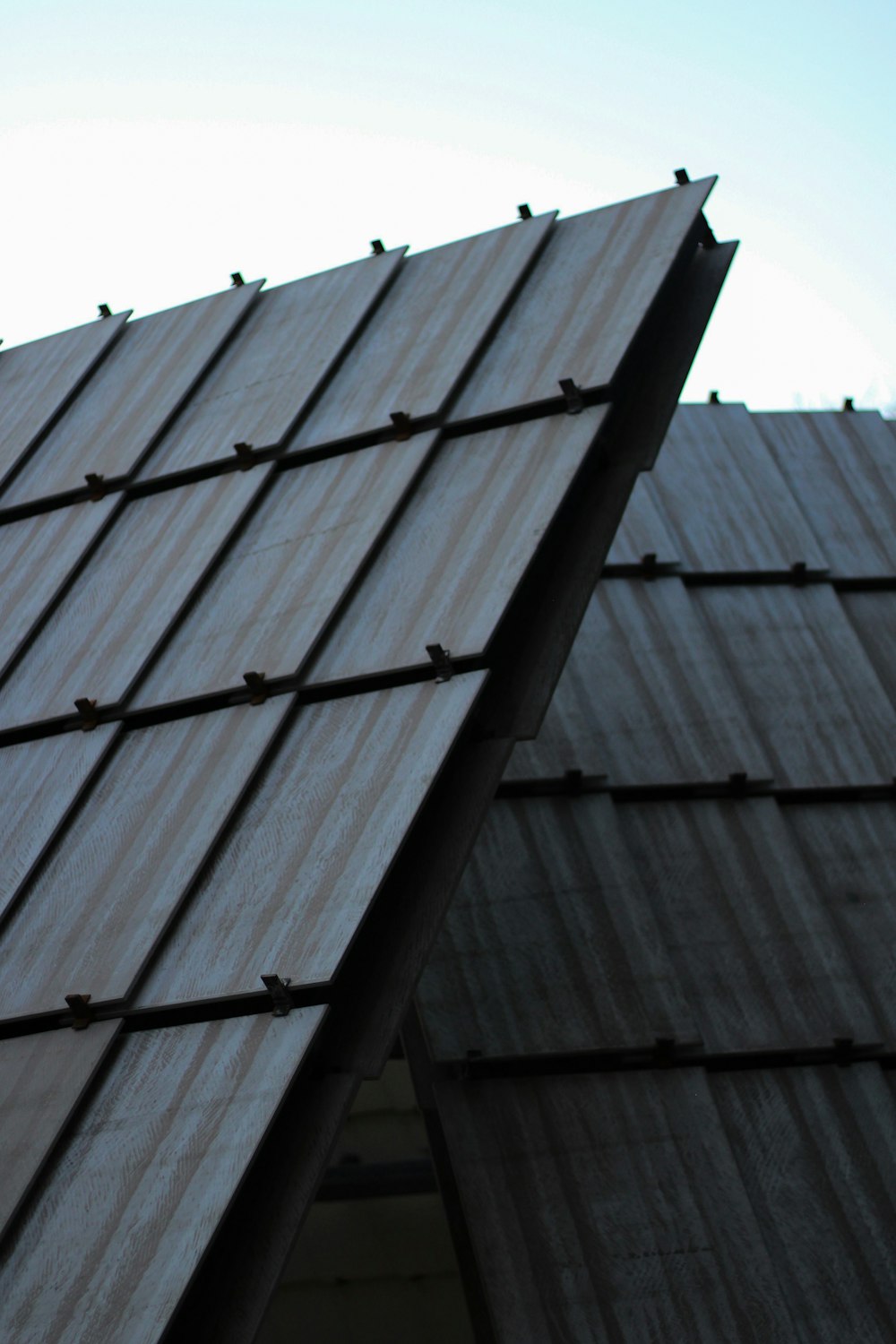 a close up of a roof with a bird perched on top of it