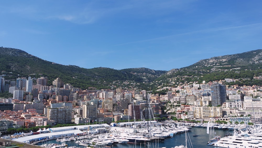 a harbor filled with lots of boats next to a city