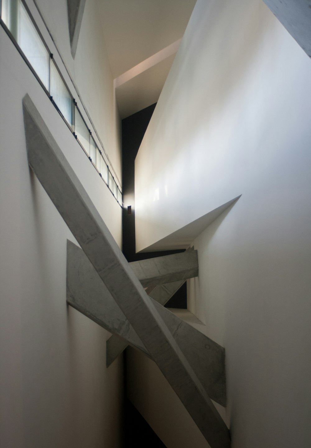 a very long and narrow staircase in a building