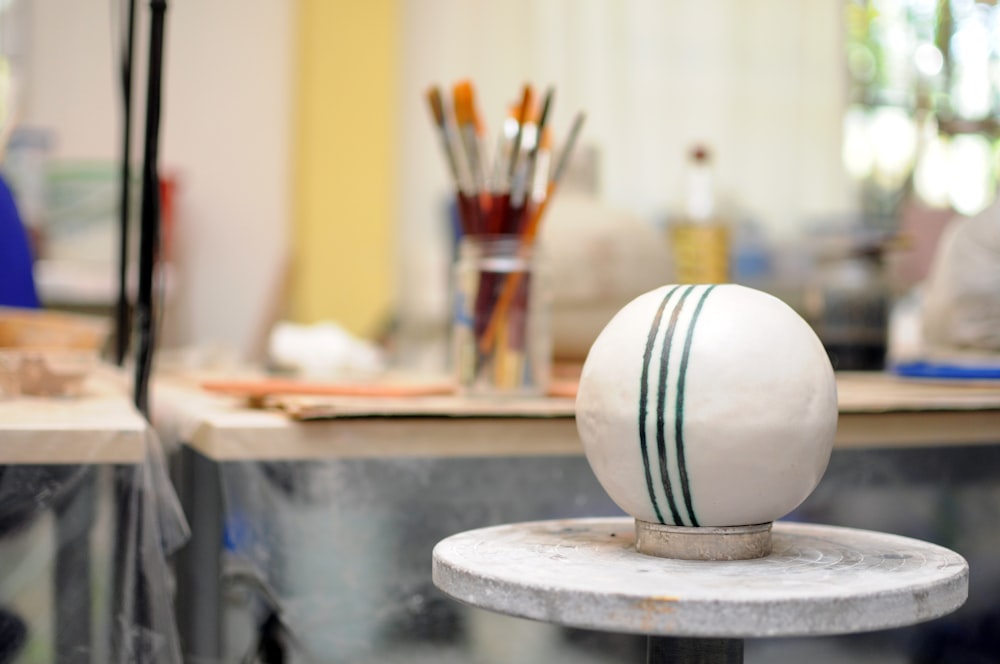 a white ball sitting on top of a table