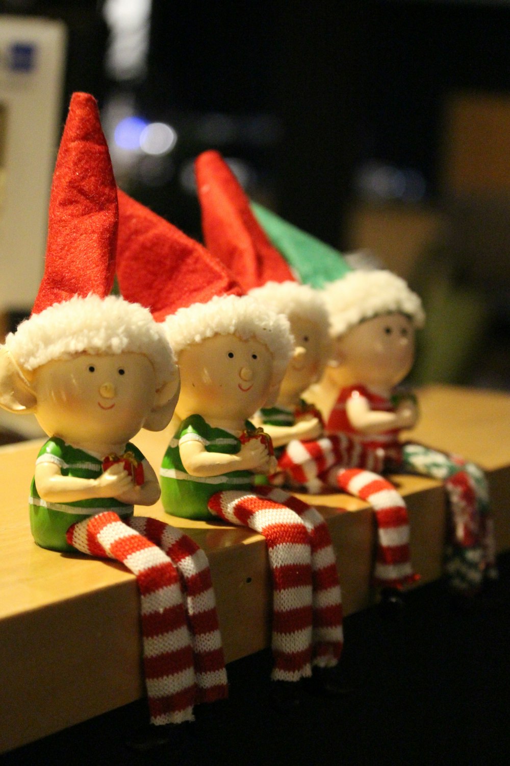 a row of elf hats sitting on top of a table