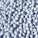 A large collection of white golf balls with dimples and printed black text scattered closely together, creating a textured pattern.