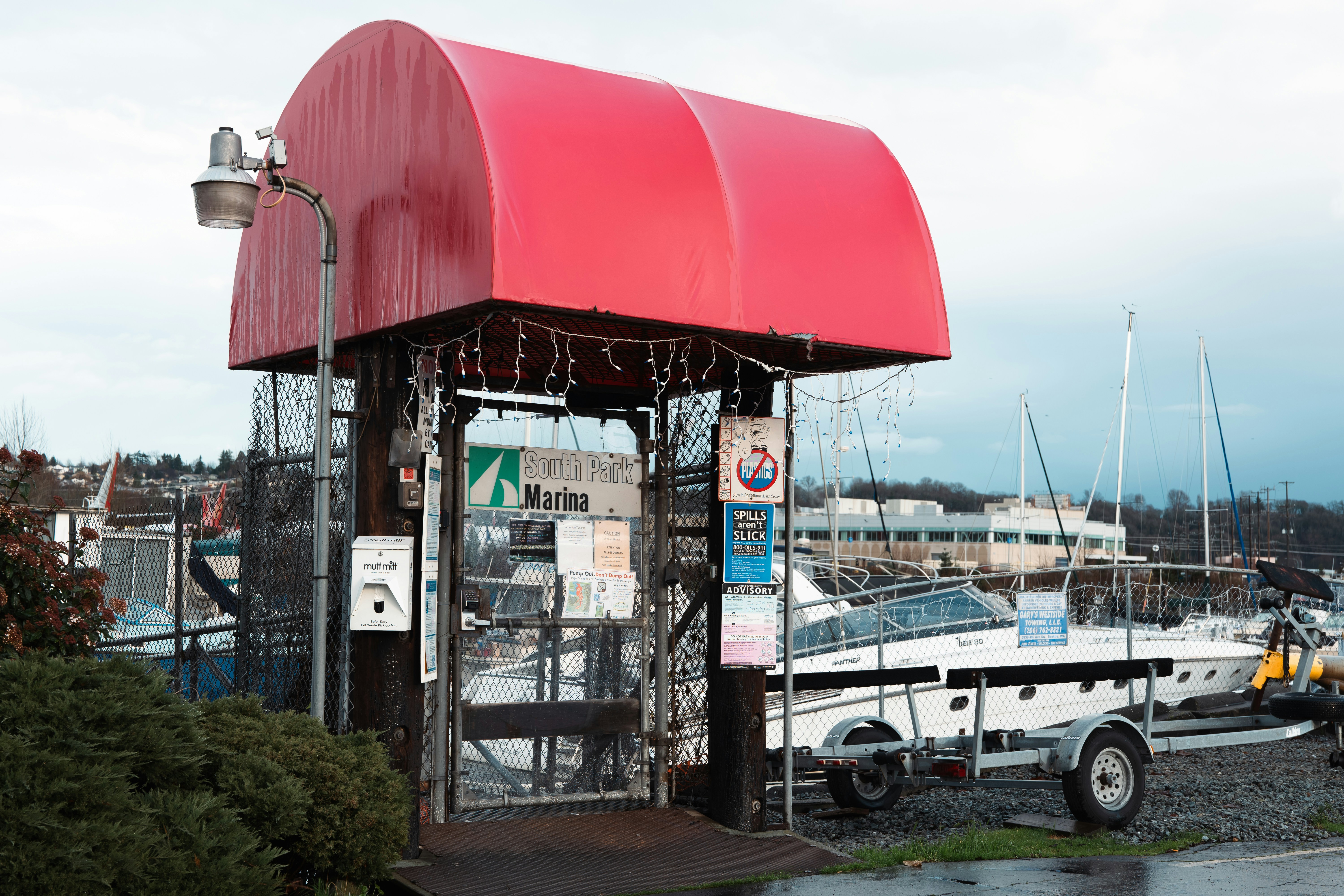 a boat is parked next to a red awning