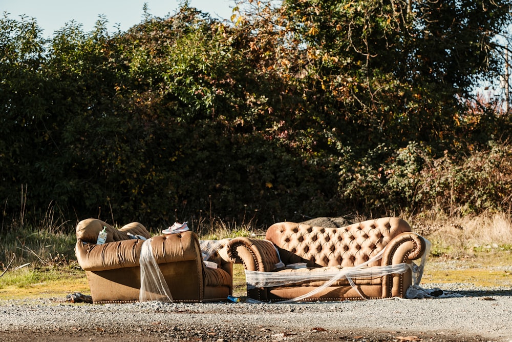 a couch sitting on the side of a road