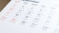 a close up of a calendar on a table