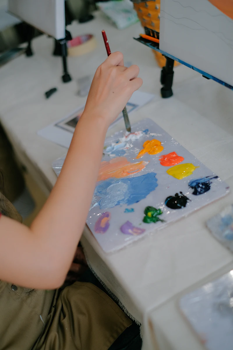 Child painting on canvas