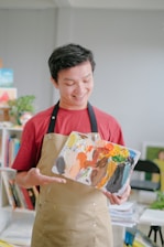 A home health aide smiling while helping a client with daily activities.