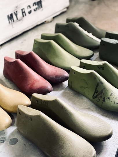 a group of shoes sitting on top of a table