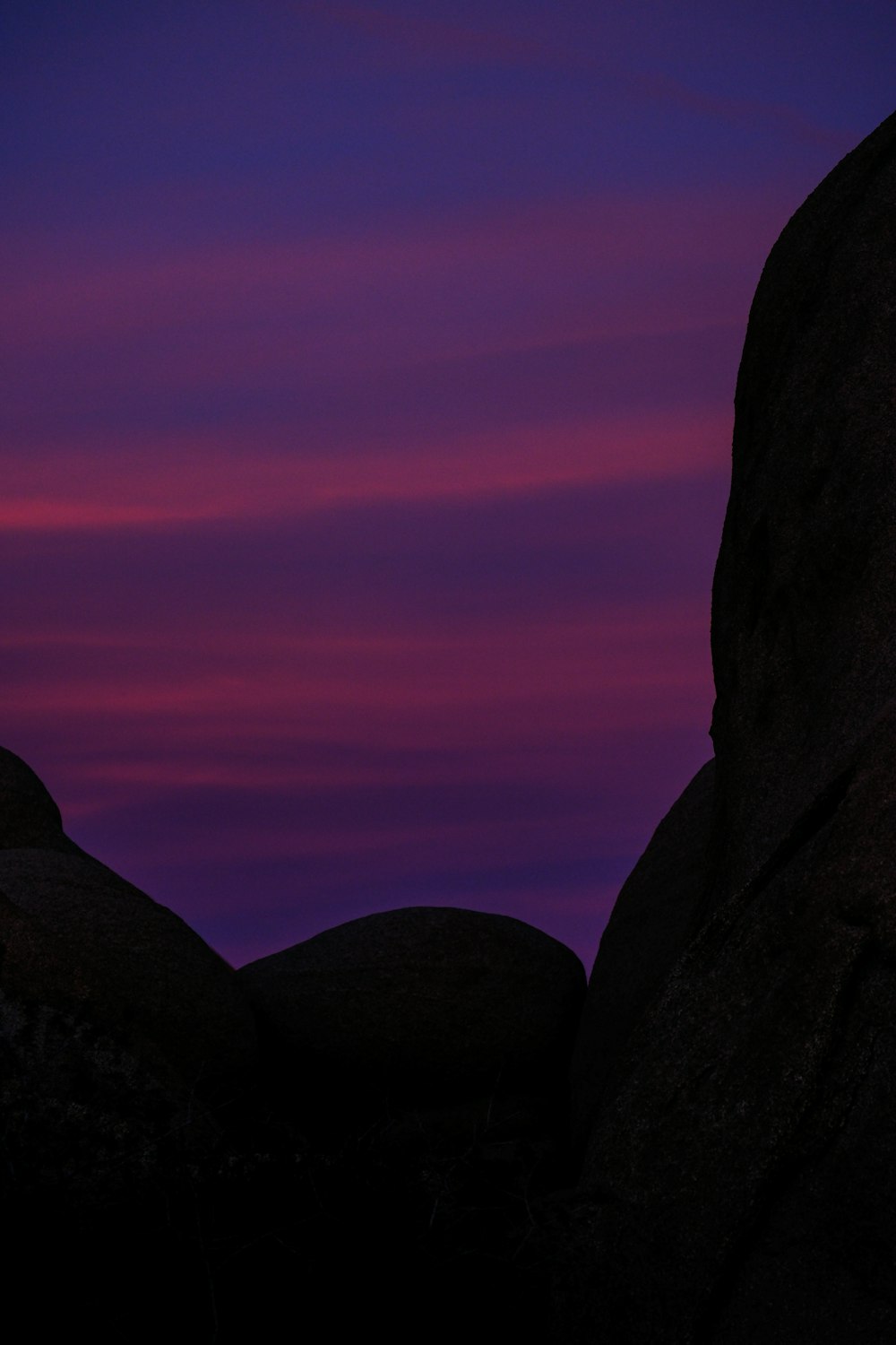 a couple of large rocks sitting next to each other