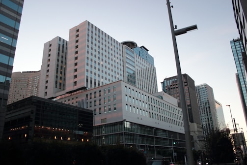 Photograph of a modern Hong Kong skyline at dusk, highlighting the city's financial district.