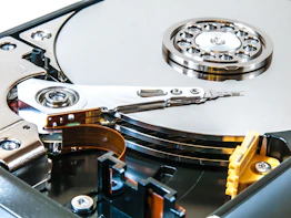 a close up of a mechanical hard drive showing platters
