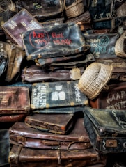 A vintage suitcase transformed into a stylish side table with a distressed paint finish.