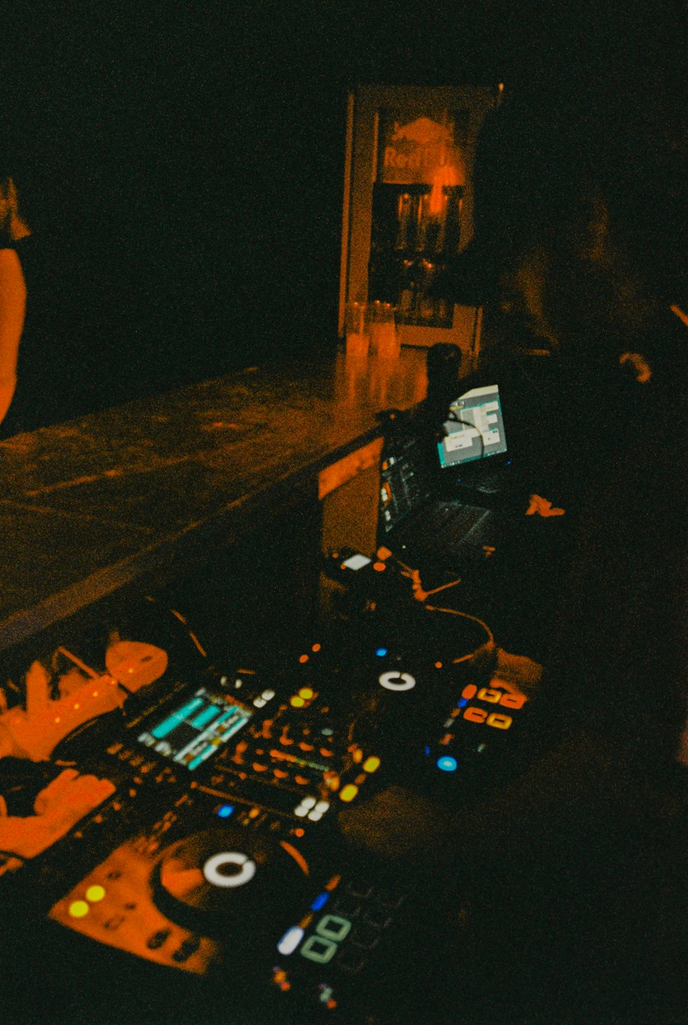 a dj mixing music in a dark room