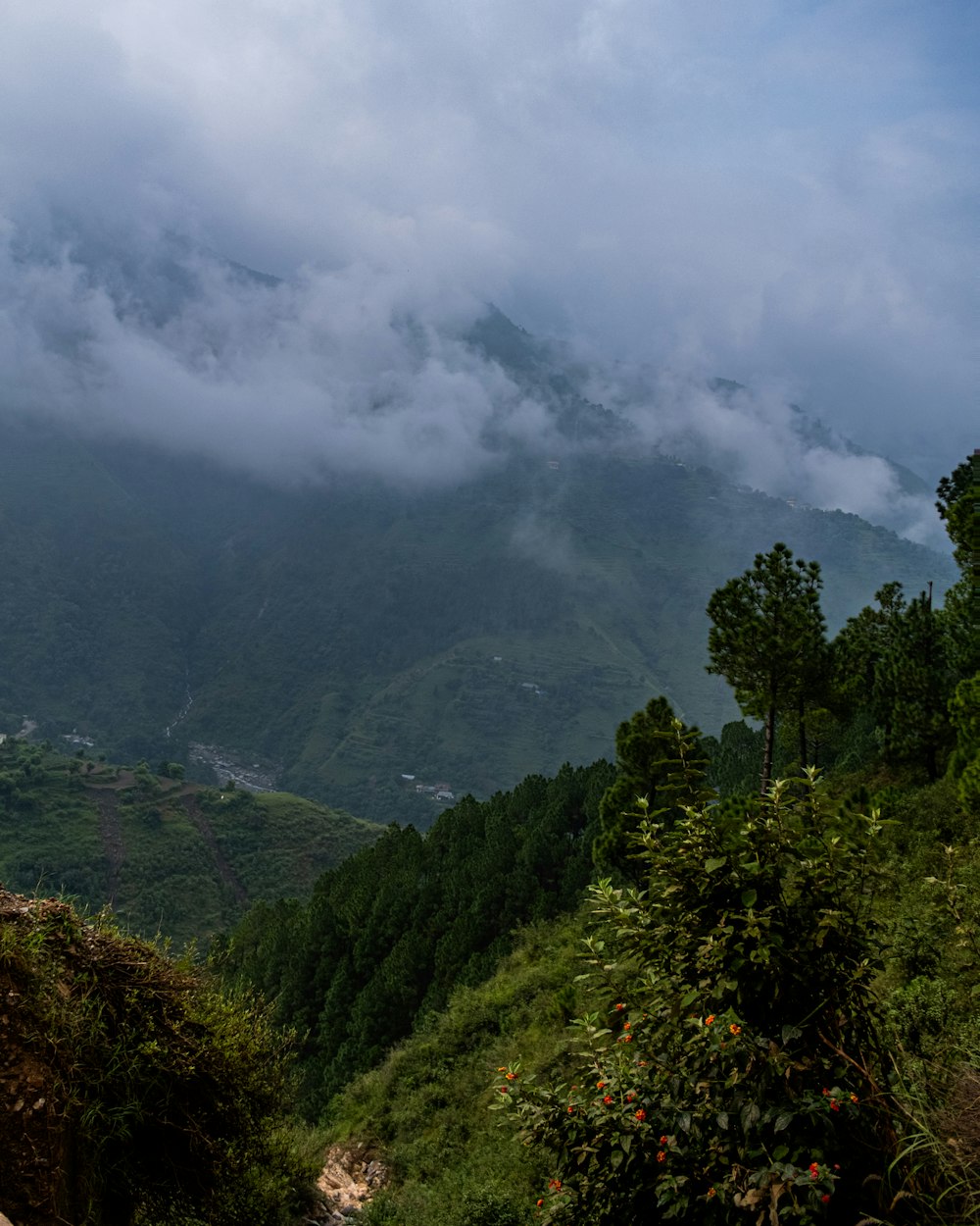 a view of a mountain range with clouds in the sky